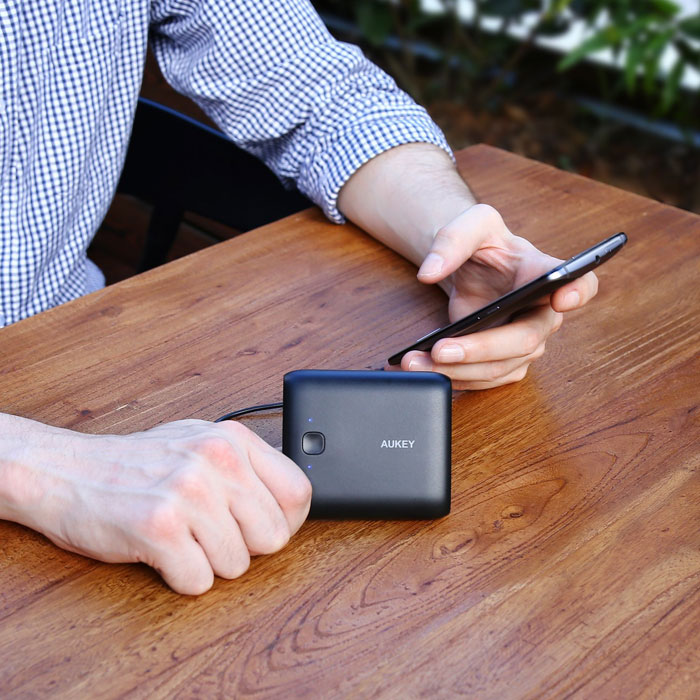 Aukey 10,000 Pocket Portable Charger in use